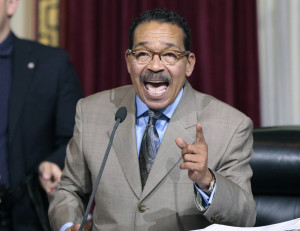 Los Angeles City Council President Herb Wesson speaks to Council members to vote to raise the minimum wage in the city to $15 an hour by 2020 in Los Angeles Wednesday, June 3, 2015. The Los Angeles City Council has voted 13-1 to raise the minimum wage to $15 an hour by 2020, but a second vote is required. The ordinance tentatively approved Wednesday had the endorsement of Mayor Eric Garcetti. A final vote will be taken June 10 because the action Wednesday was not unanimous. The increases would begin with a wage of $10.50 in July 2016, followed by annual increases to $12, $13.25, $14.25 and then $15. Small businesses and nonprofits would be a year behind. (AP Photo/Damian Dovarganes )