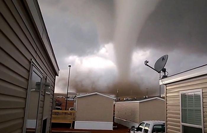 This Monday, May 26, 2014 photo from video provided by Dan Yorgason, shows a tornado in a worker's camp near Watford City, N.D., in the heart of the state's booming oil patch. The tornado injured nine people, including a 15-year-old girl who suffered critical injuries, and damaged or destroyed more than a dozen trailers at the camp. (AP Photo/Dan Yorgason)