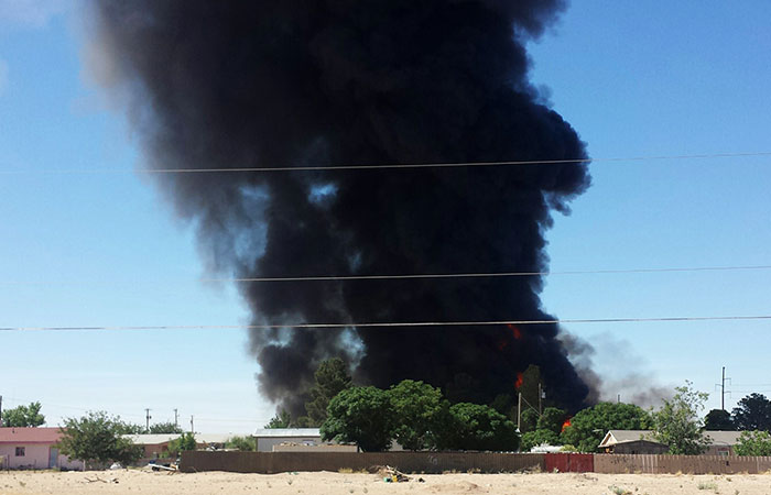 Smoke rises from a fire at Rio Valley Biofuels near Anthony, New Mexico, on Tuesday. The area was evacuated because of the threat of the blasts from methanol on the premises, according to authorities. Other chemicals included vegetable oil, hydrochloric acid and bio-diesel fuel. (Miguel Favela/Associated Press)