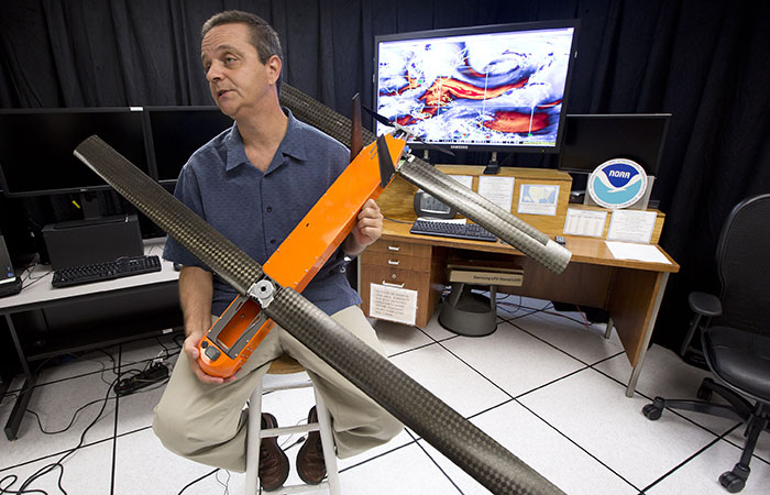 Joe Cione, a hurricane researcher at the National Oceanic and Atmospheric Administration holds a drone he hopes to use this hurricane season for research on the storm's intensity. He hopes to find more information about how warm water, which fuels a hurricane, transfers energy to tropical storms. ( J. Pat Carter/The Associated Press).