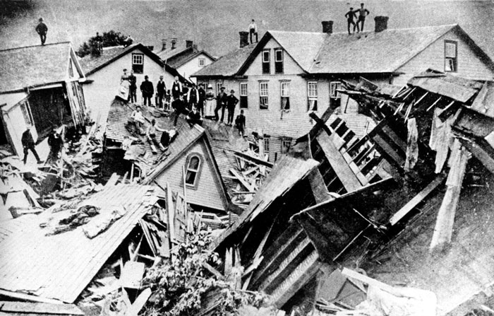 Citizens stand atop the ruins of houses destroyed in the 1889 file photo showing the aftermath of the Johnstown, Pennsylvania  flood. The historic disaster's 125th anniversary is May 31, 2014. 