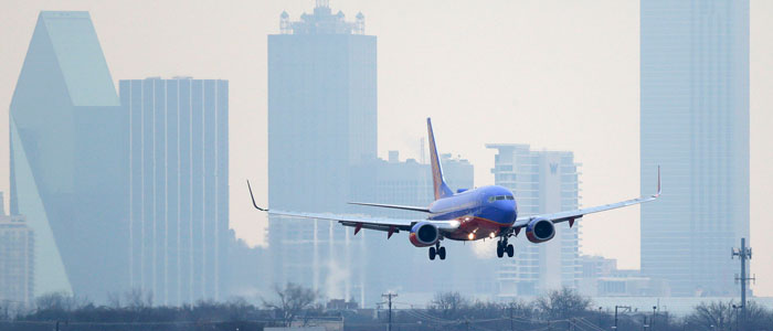 A Southwest Airlines jet plane lines up for a landing at Love Field in Dallas, where the company is headquartered.