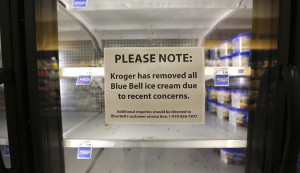 In this April 21, 2015 file photo, a sign explains why shelves sit empty of Blue Bell ice cream at a grocery store in Dallas. Blue Bell Creameries will lay off more than a third of its workforce following a series of listeria illnesses linked to its ice cream that prompted a nationwide recall, the Texas company announced Friday, May 15, 2015 (AP Photo/LM Otero, File)