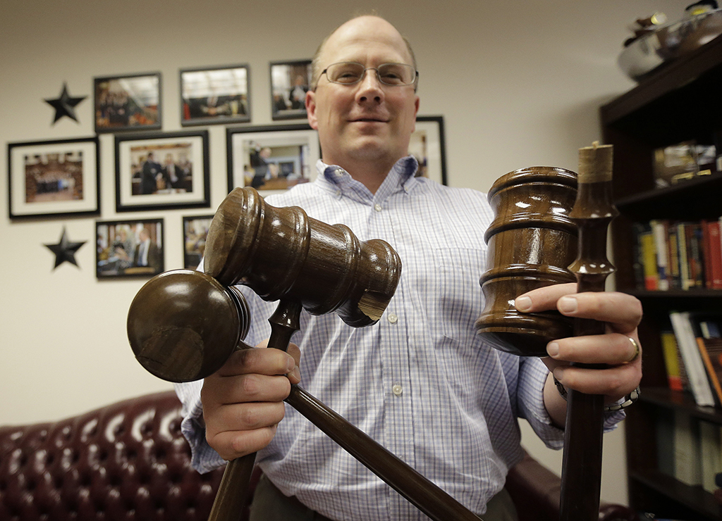 Texas Rep. Kenneth Sheets, R-Dallas, poses with three of the six solid, mahogany gavels he broke during the legislative session this year, Monday, June 1, 2015, in Austin, Texas. At 5-feet-5-inches, Sheets is one of the smallest members of the Texas Legislature, but he's broken six solid, mahogany gavels crafted by Texas prison inmates this session alone, outpacing any other lawmaker. (AP Photo/Eric Gay)