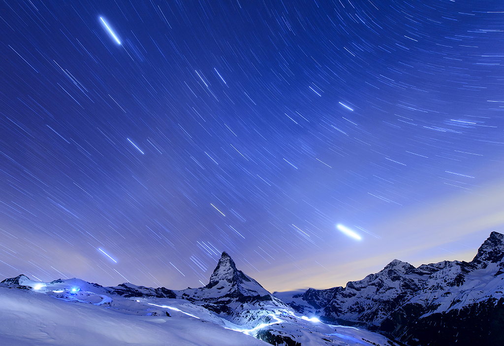 In this , April 13, 2015 file photo, taken with a long time exposure, stars are pictured over the Matterhorn mountain, near Zermatt, Switzerland. Switzerland’s most famous mountain, will be closed to climbers on the 150th anniversary next month of the first ascent.The Alpine resort of Zermatt says the 24-hour shutdown July 14 is intended as a mark of respect to more than 500 climbers who have died on the mountain, starting with four of the seven-strong team that first reached the summit in 1865. (Jean-Christophe Bott/Keystone via AP,File)